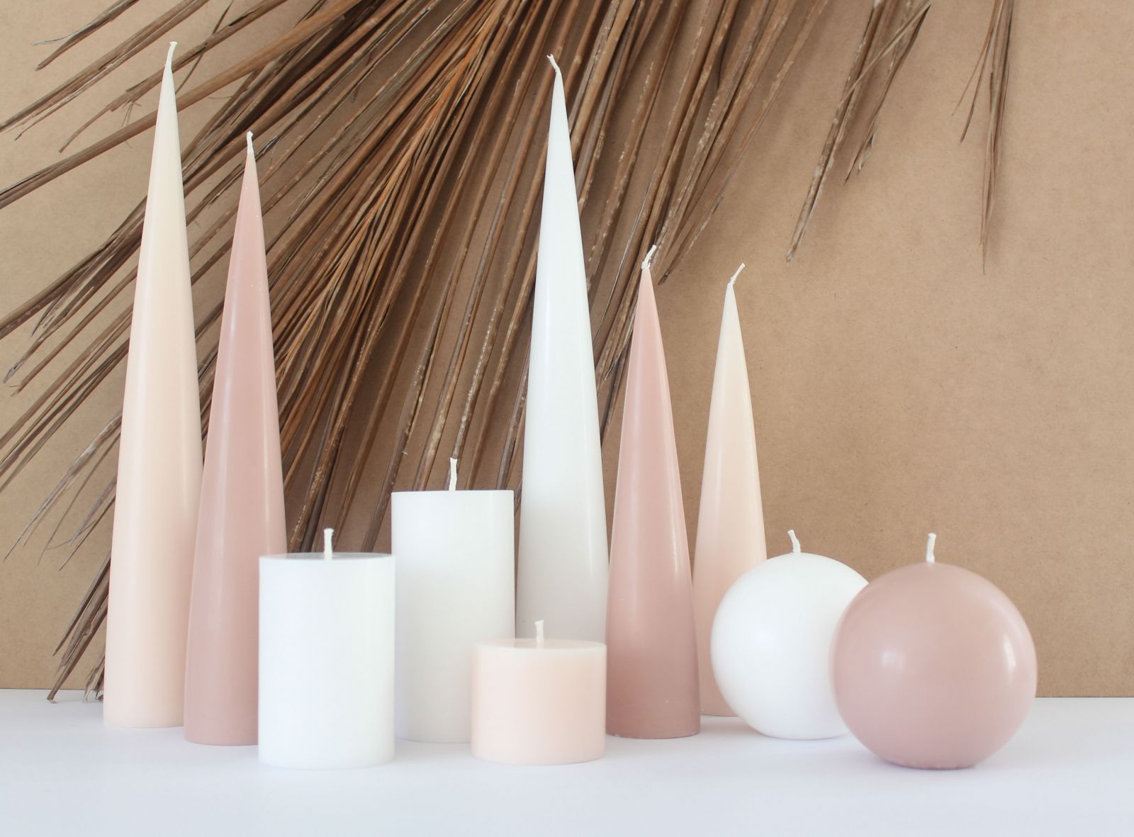 image of cone candles with ball candles and pillar candles in shades of taupe, nude and white
